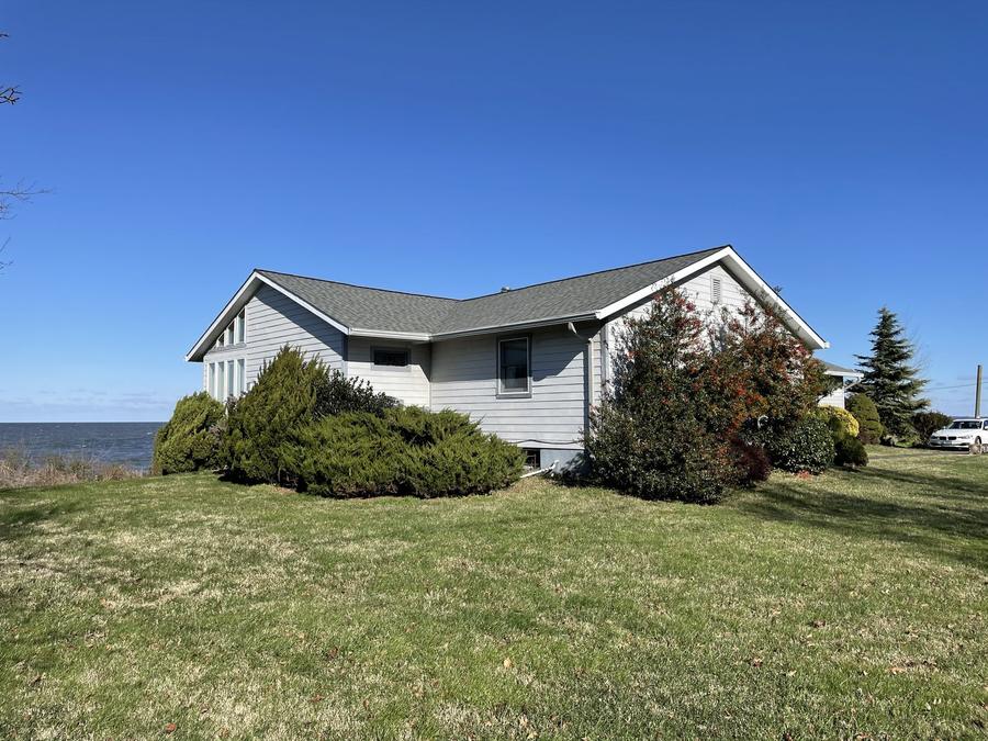 Waterfront home with new roof and siding