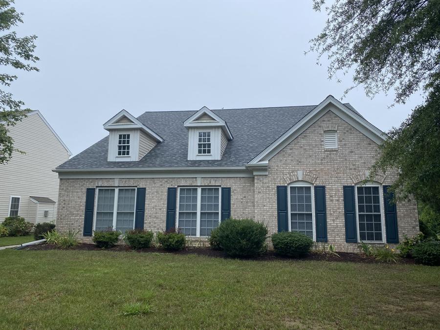 Brick and siding home with a new roof